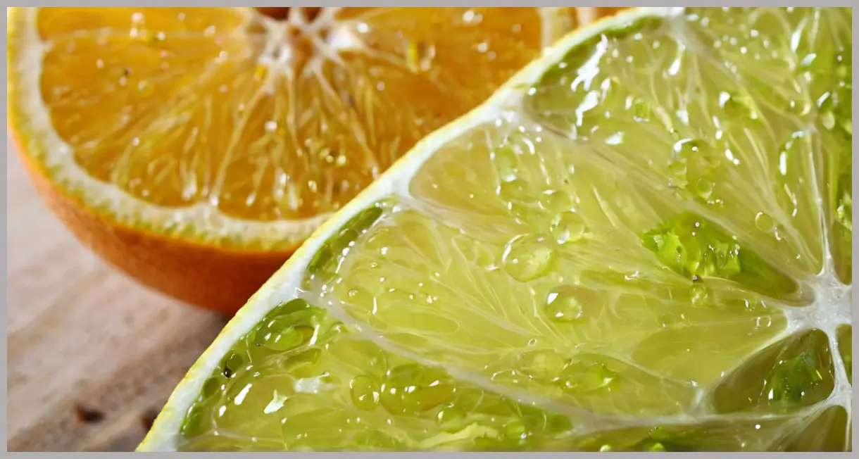 A glowing lime wedge in golden light, surrounded by aromatic spices, ultra-sharp macro focus on citrus texture. Lime pickle